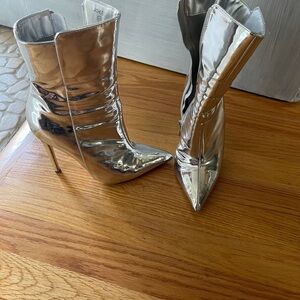 Silver boots they say a size 5.5 but I’m a size 7